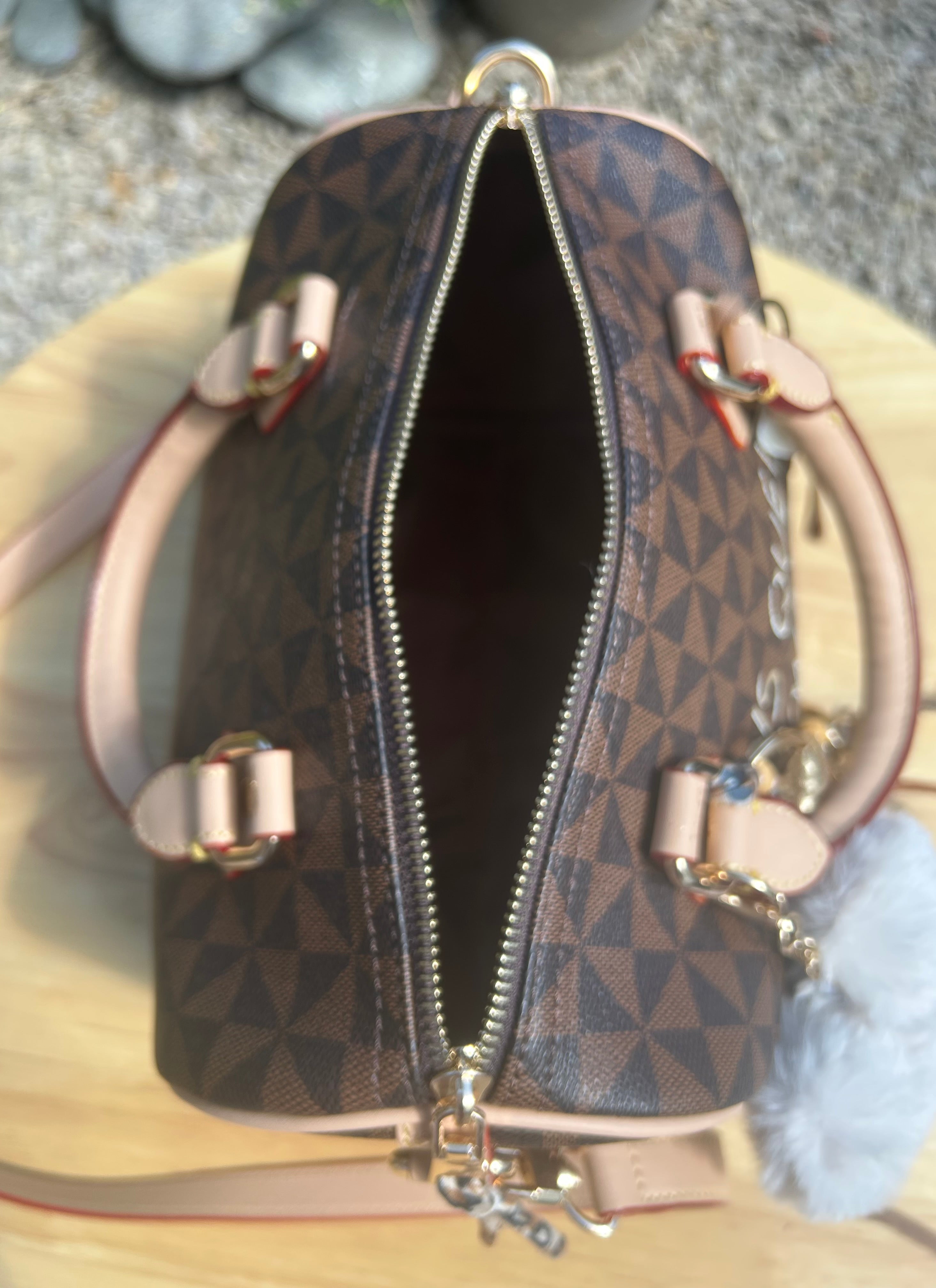 Sac Boston marron Dans quel monde Vit-on