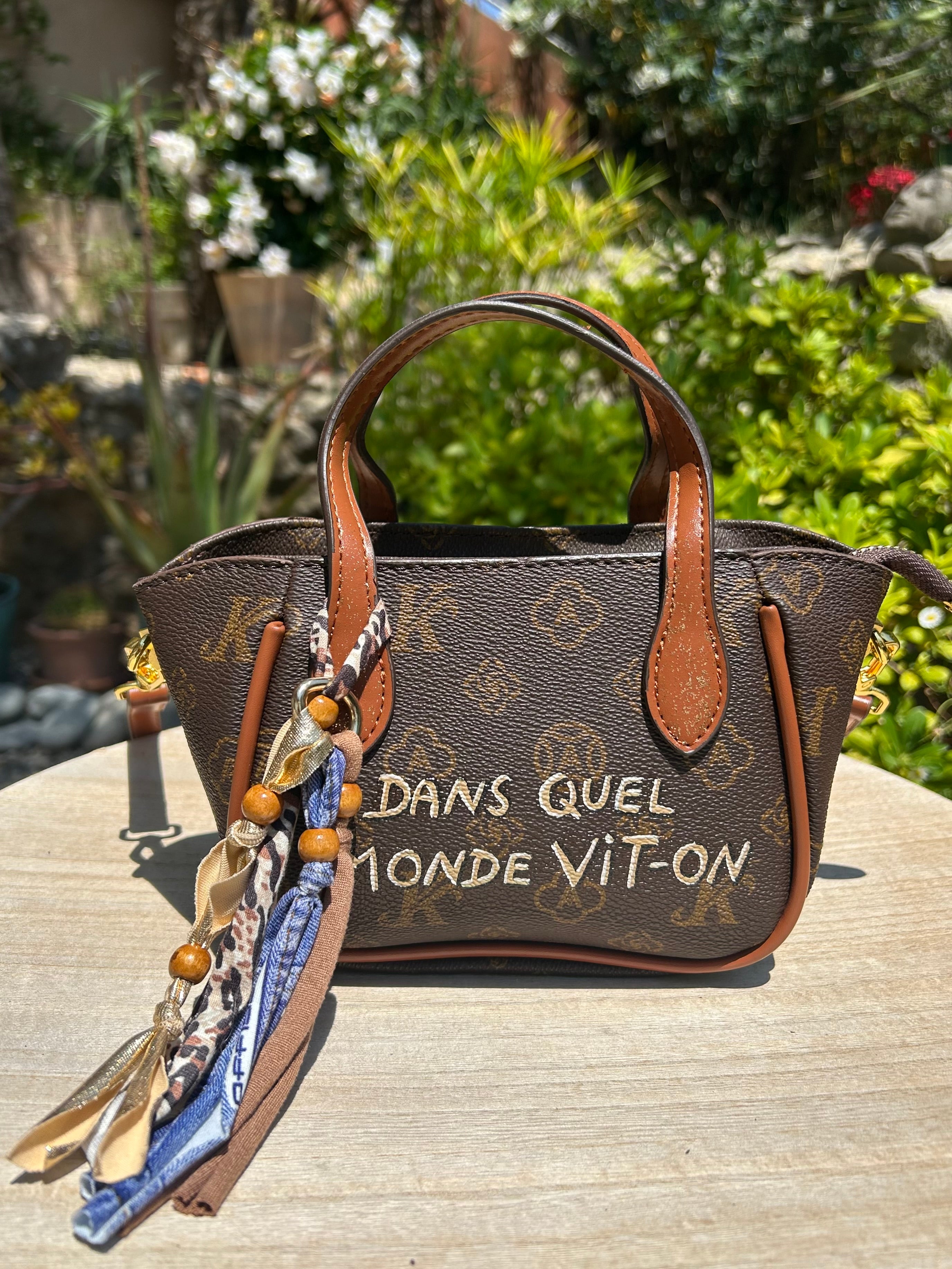 Mini sac Dans quel monde Vit-on