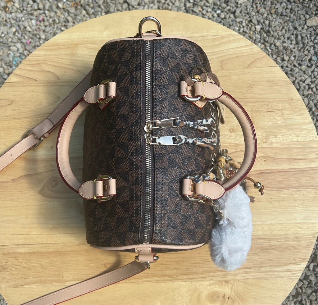 Sac Boston marron Dans quel monde Vit-on