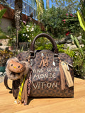 Sac Boston marron DANS QUEL MONDE VIT-ON