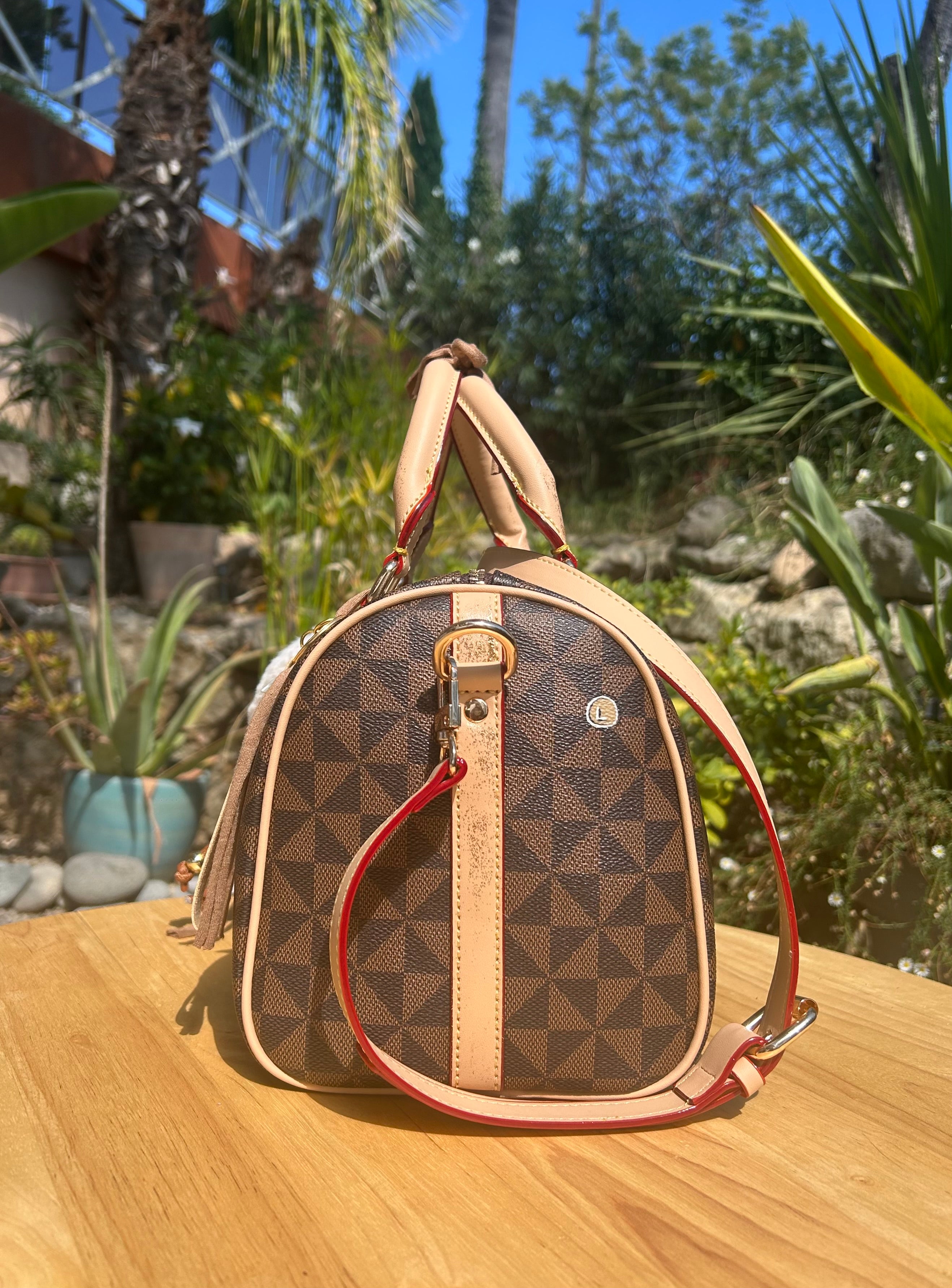 Sac Boston marron Dans quel monde Vit-on